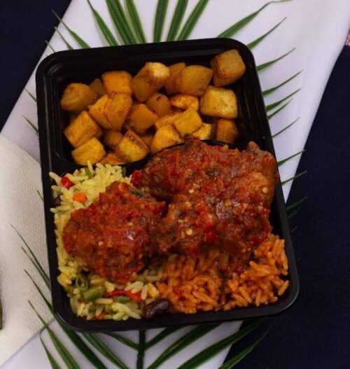 Naija Party Combo (Fried & Jollof rice) with Chicken, Hake Fish and Side of Vegetable Salad