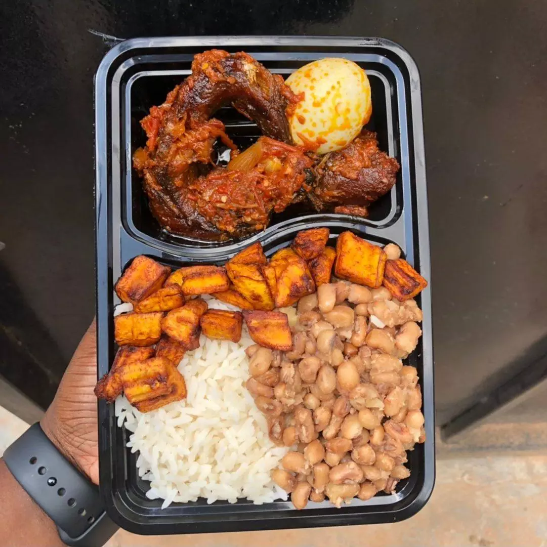 Mama put combo: White rice and beans with plantain, smoked fish, beef and egg