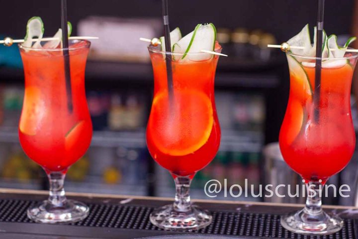 three cocktails in a row on bar