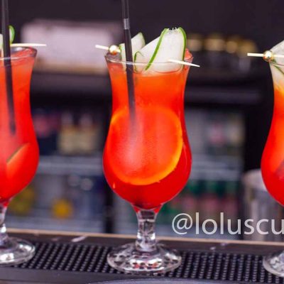 three cocktails in a row on bar